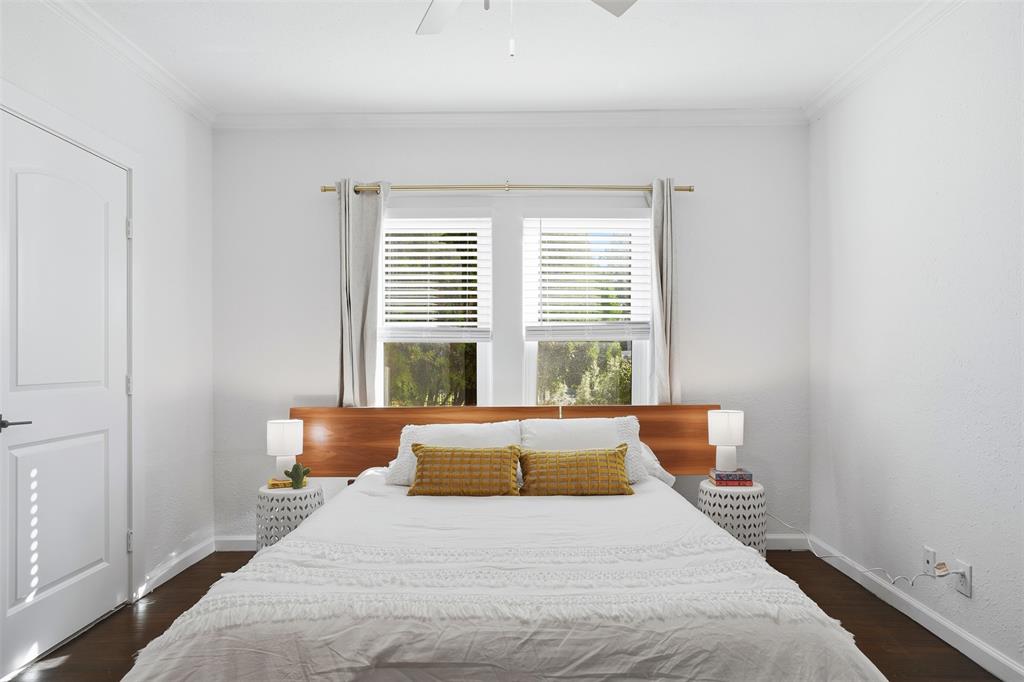 1102 Brunner Avenue Dallas, TX 75224 - Photo 24 of 38 a bedroom with bed and wooden floor