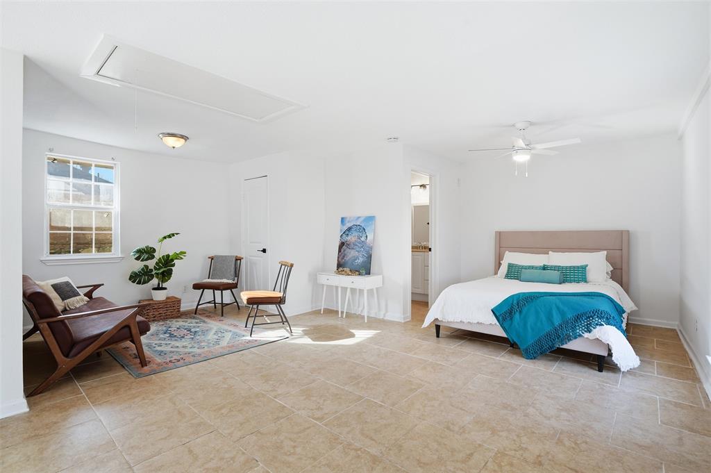 1102 Brunner Avenue Dallas, TX 75224 - Photo 32 of 38 a spacious bedroom with a bed and a couch