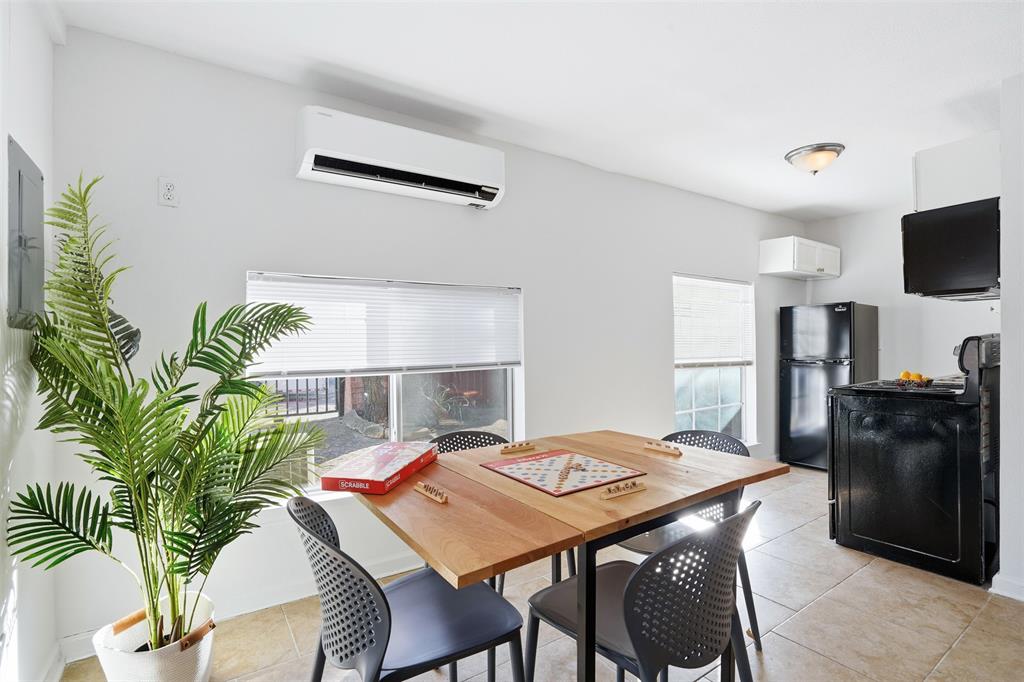 1102 Brunner Avenue Dallas, TX 75224 - Photo 37 of 38 a view of a dining room with furniture and a kitchen
