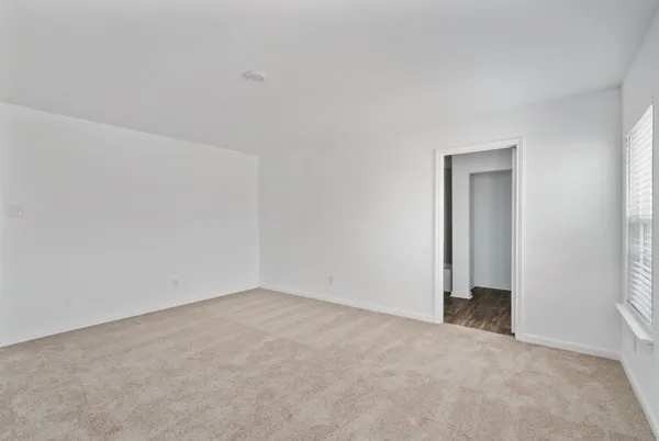 a view of an empty room and closet