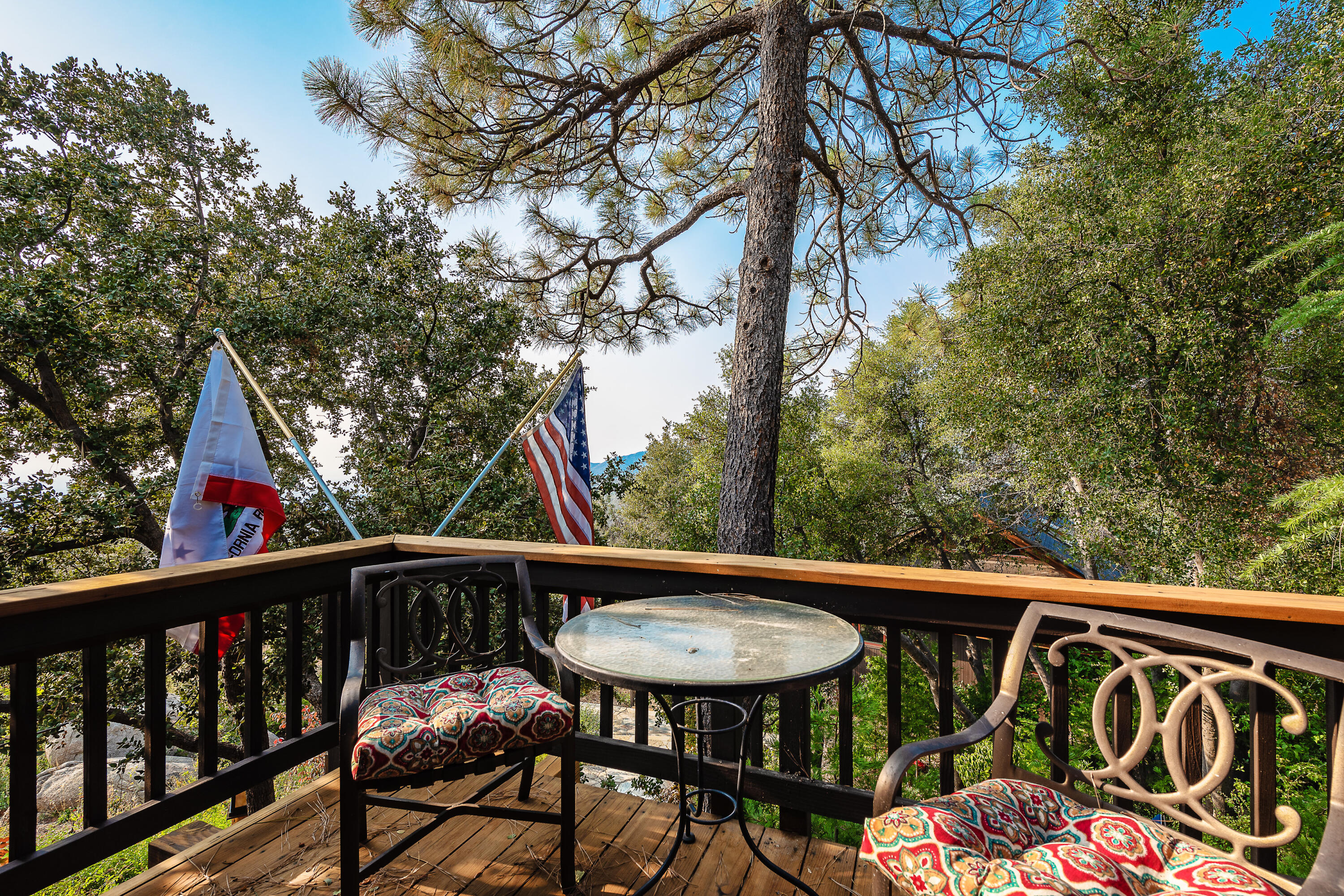 52430 Double View Drive Idyllwild, CA 92549 - Photo 28 of 74 a view of a chair and table on the deck