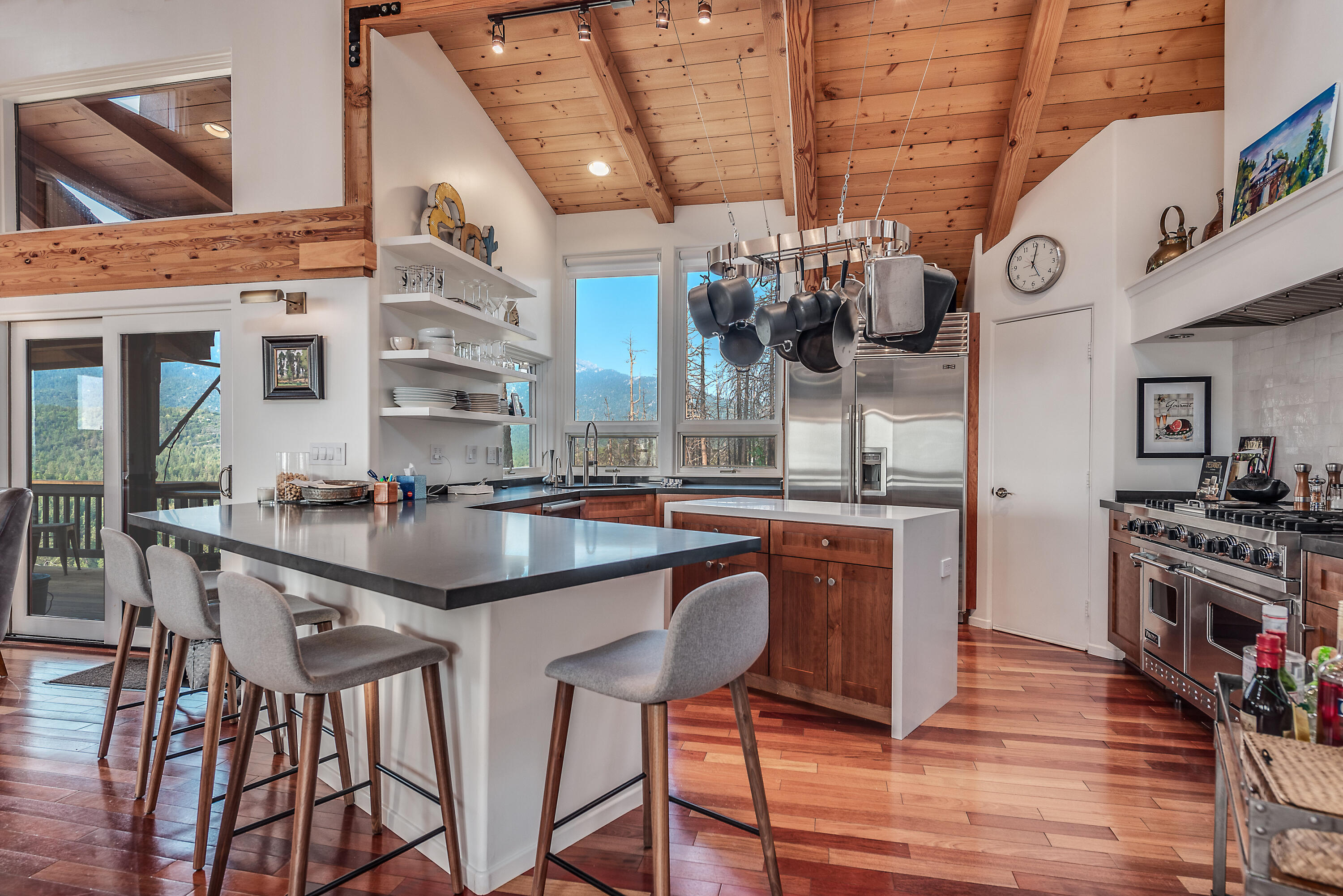52430 Double View Drive Idyllwild, CA 92549 - Photo 40 of 74 a kitchen with stainless steel appliances granite countertop a stove a sink and a refrigerator