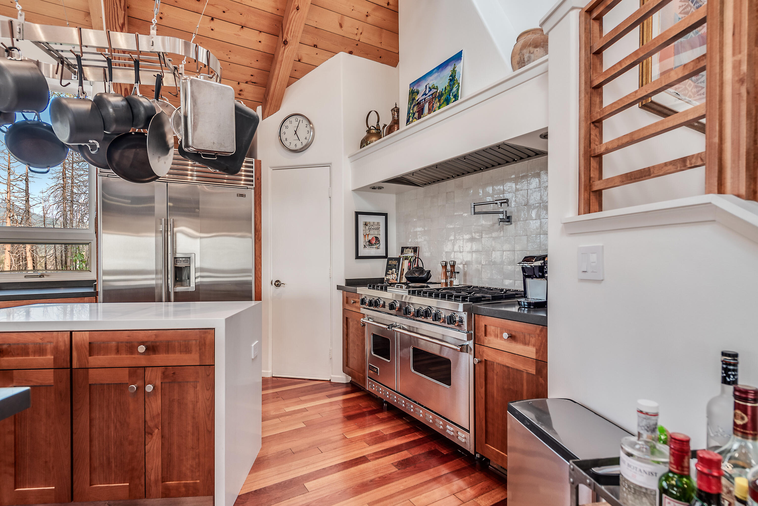 52430 Double View Drive Idyllwild, CA 92549 - Photo 41 of 74 a kitchen with a stove cabinets and wooden floor