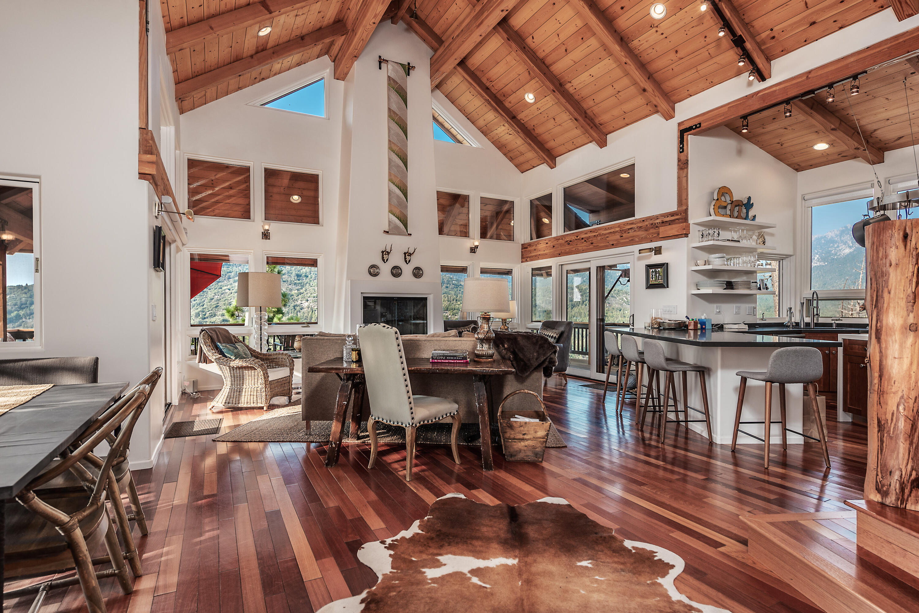 52430 Double View Drive Idyllwild, CA 92549 - Photo 43 of 74 a view of a dining room with furniture and wooden floor