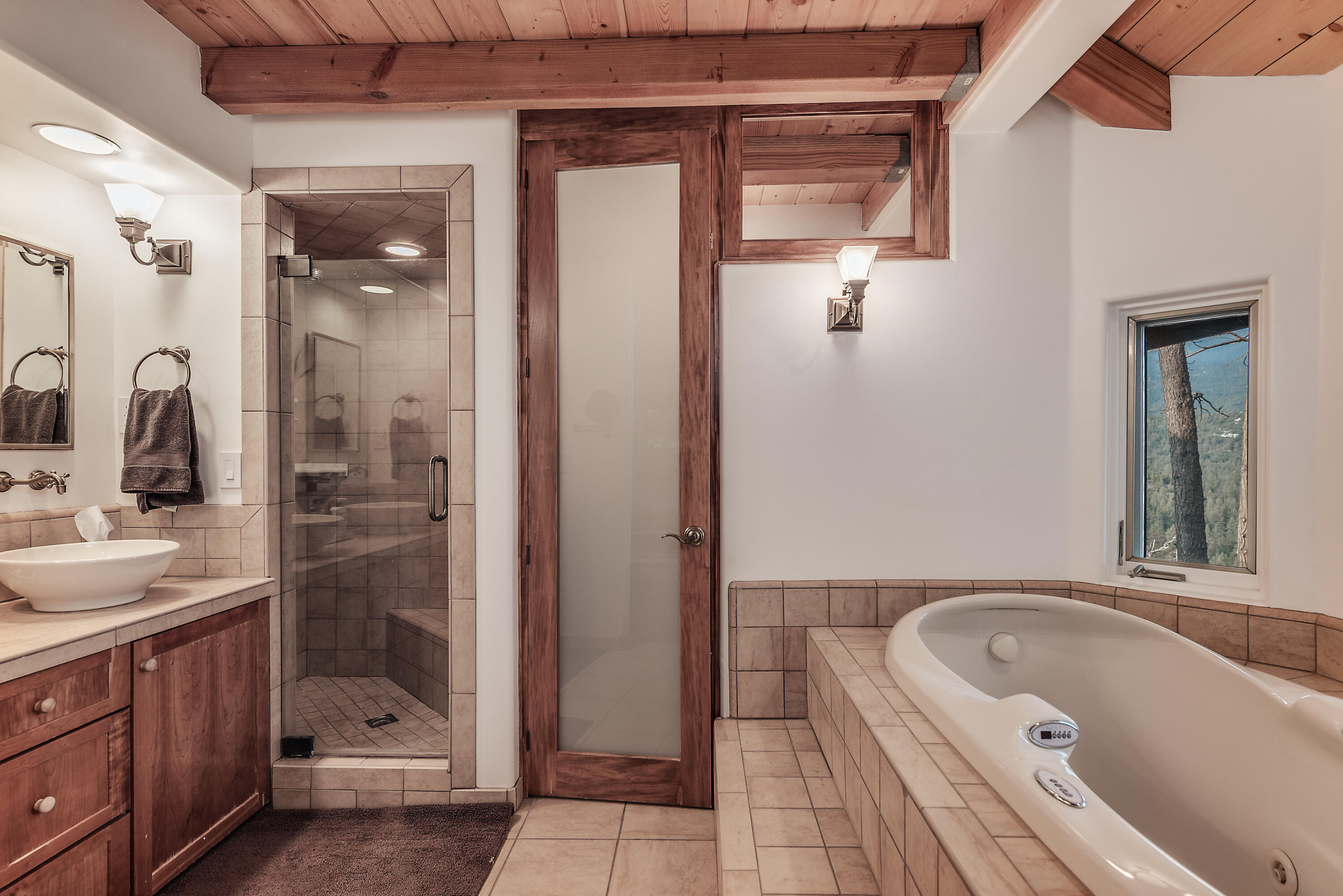 52430 Double View Drive Idyllwild, CA 92549 - Photo 58 of 74 a bathroom with a tub a sink and mirror