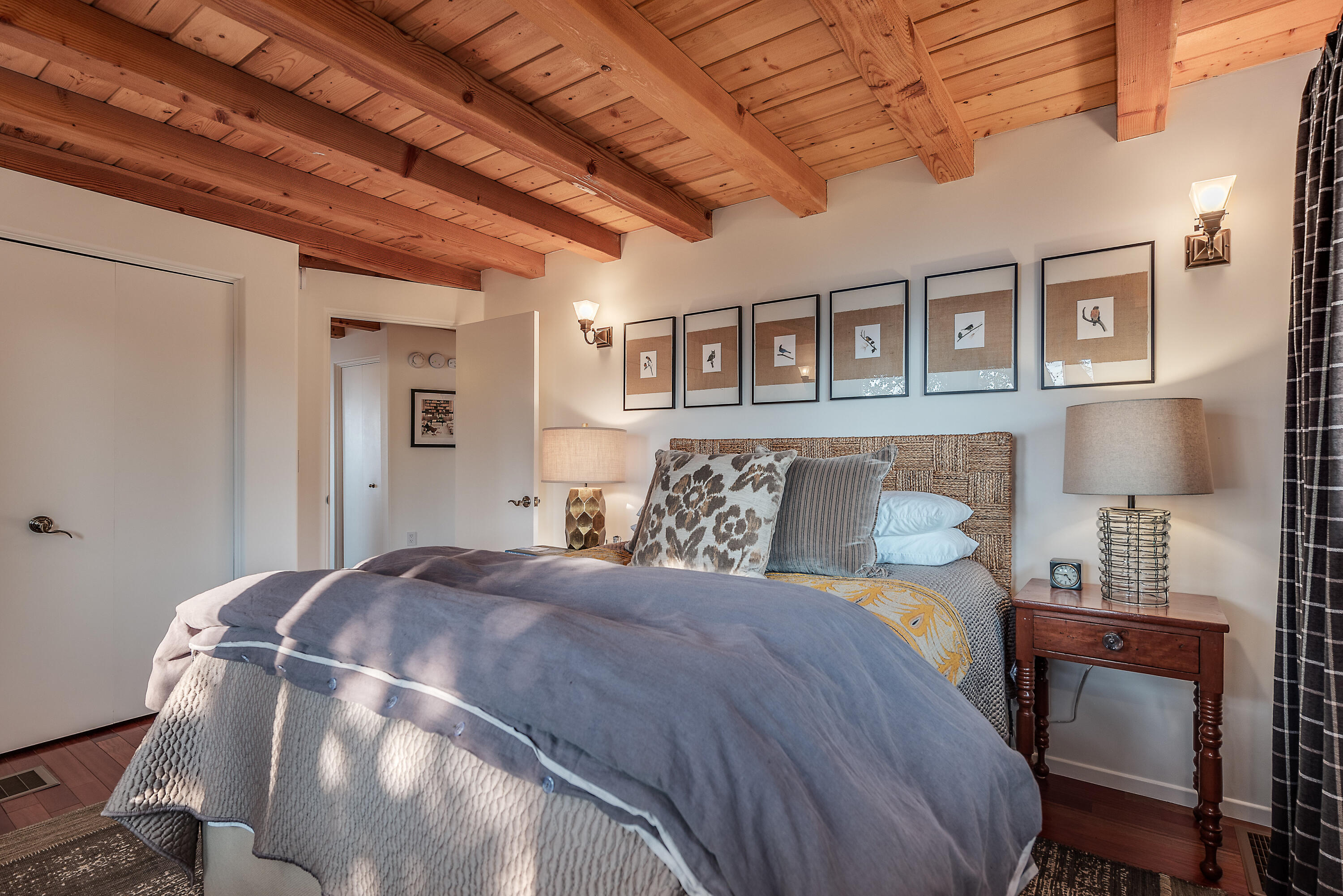 52430 Double View Drive Idyllwild, CA 92549 - Photo 60 of 74 a large bed sitting in a bedroom next to a chandelier