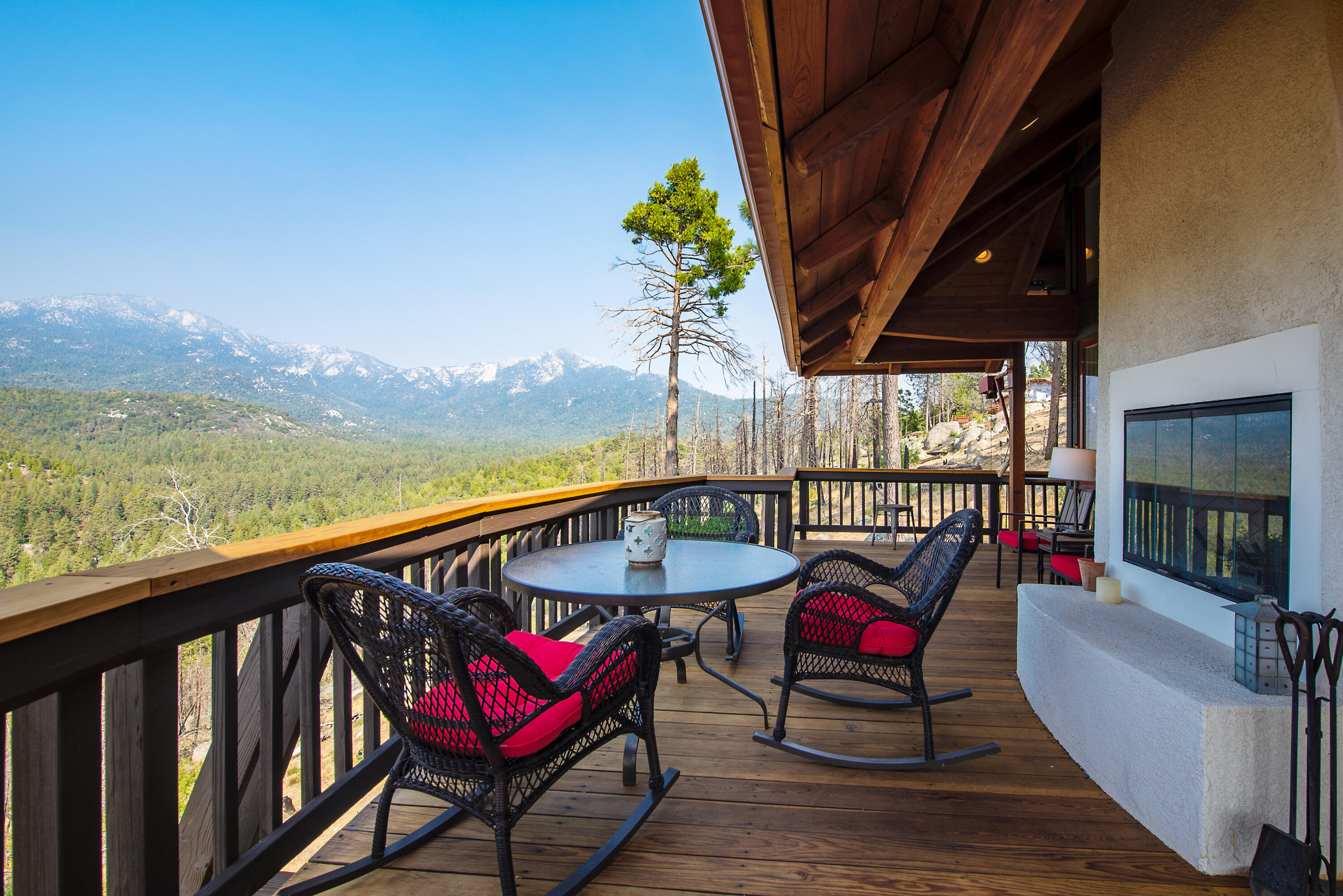 52430 Double View Drive Idyllwild, CA 92549 - Photo 65 of 74 a view of a balcony with furniture and a floor to ceiling window