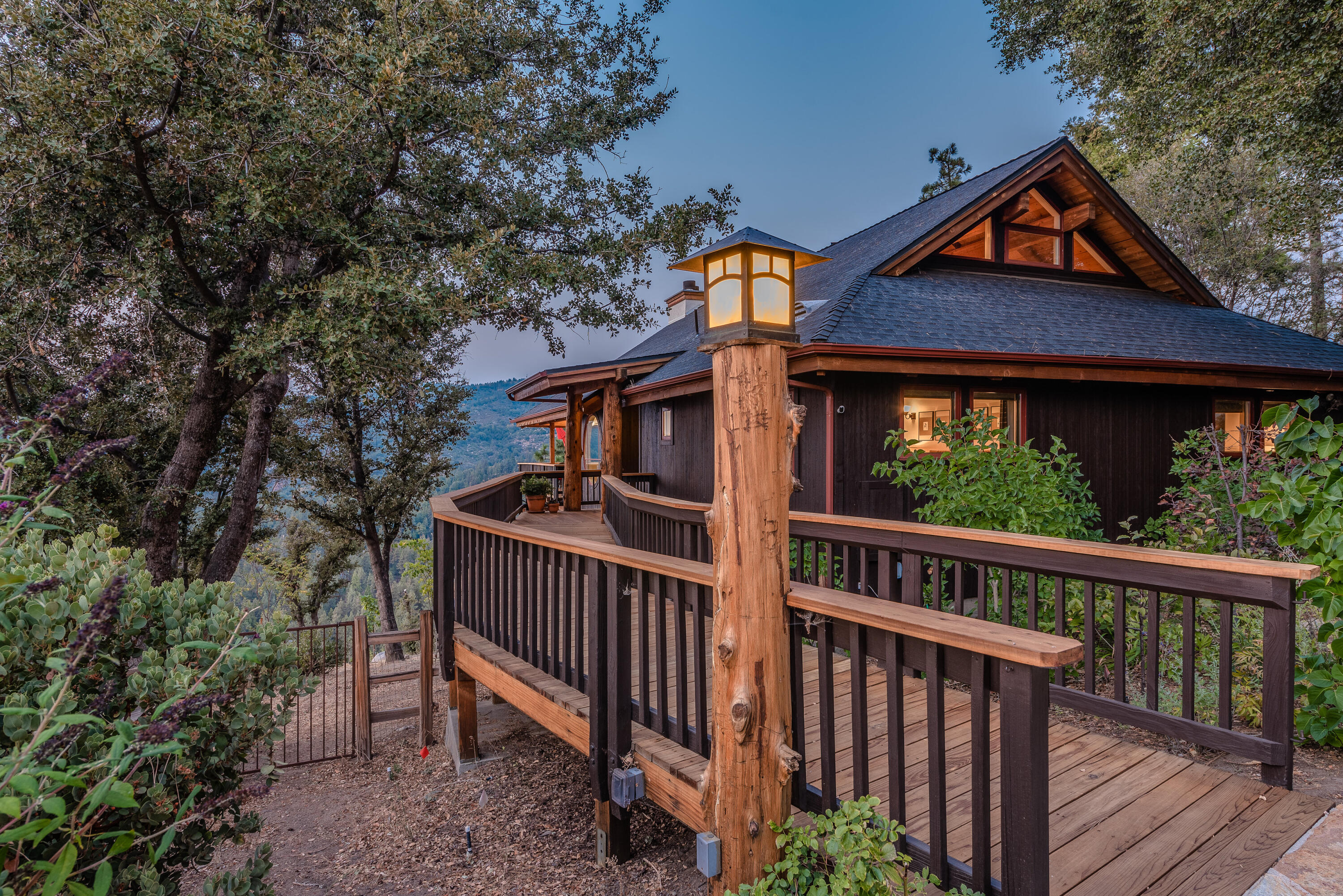 52430 Double View Drive Idyllwild, CA 92549 - Photo 8 of 74 a view of wooden house with a small yard and wooden fence