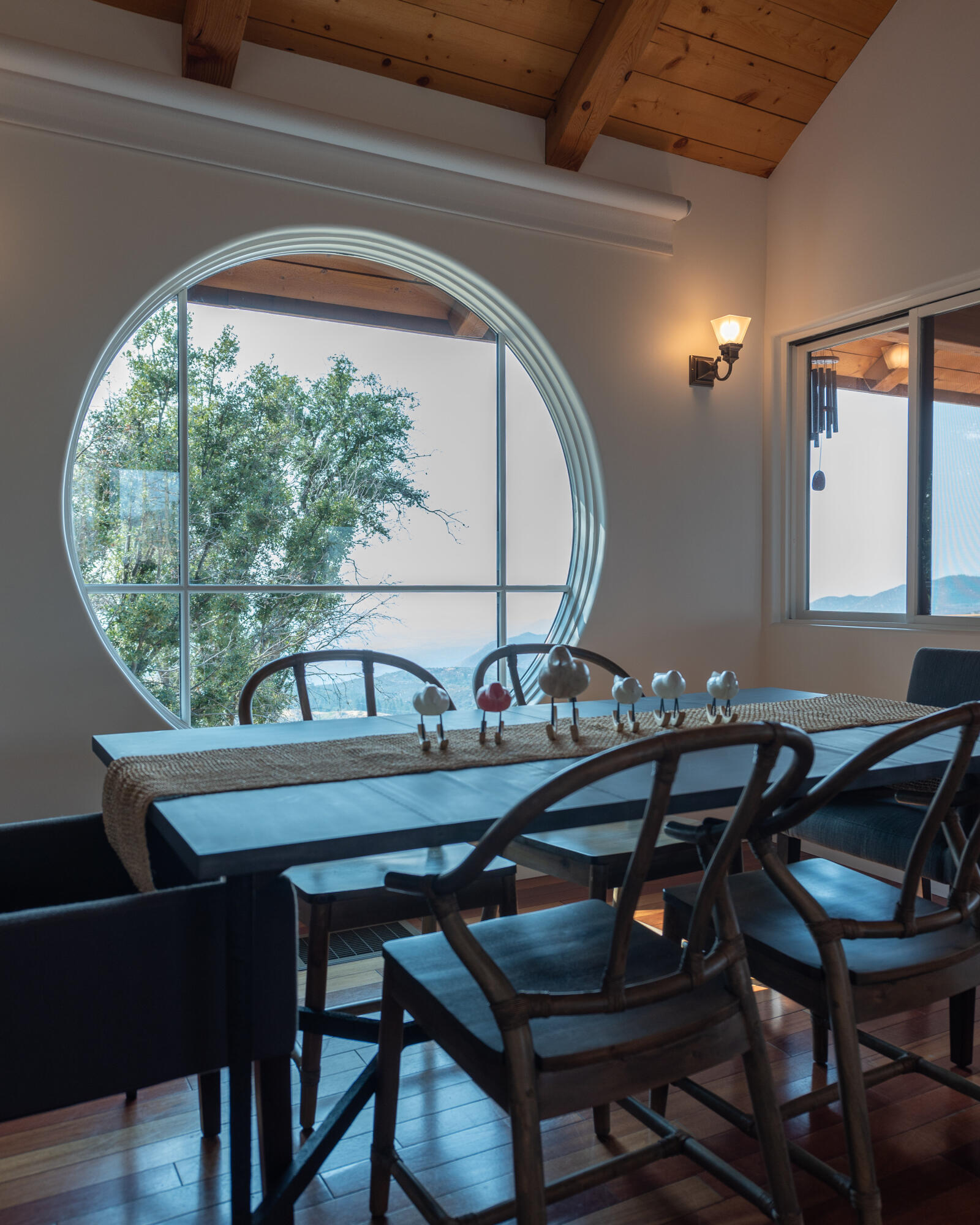 52430 Double View Drive Idyllwild, CA 92549 - Photo 9 of 74 a view of a dining room with furniture and wooden floor