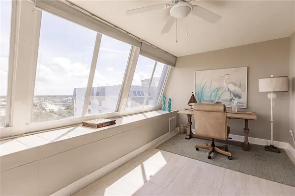 a workspace with furniture and a window