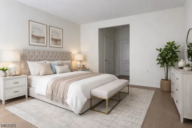 a bathroom with a tub a sink and mirror