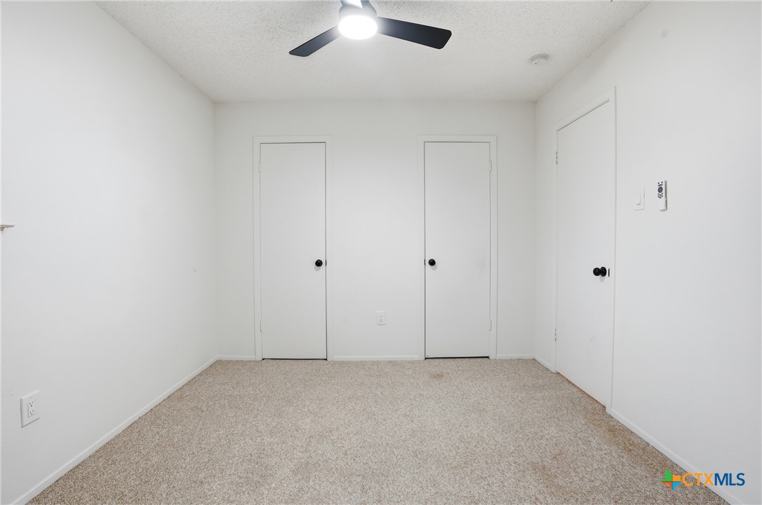 922 North 7th Street Copperas Cove, TX 76522 - Photo 21 of 26 an empty room with chandelier fan
