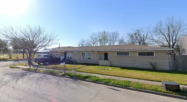 a view of a house with a big yard