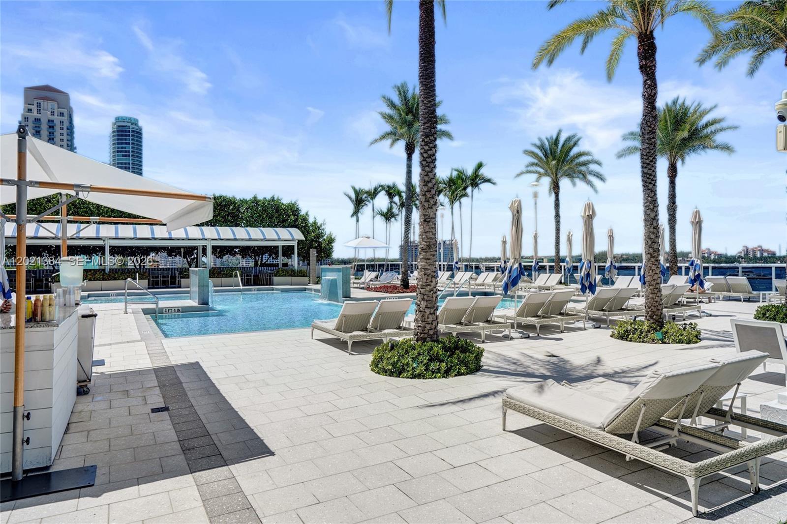 400 Alton Road, Unit PH11 Miami Beach, FL 33139 - Photo 8 of 49 a view of a swimming pool and lounge chair
