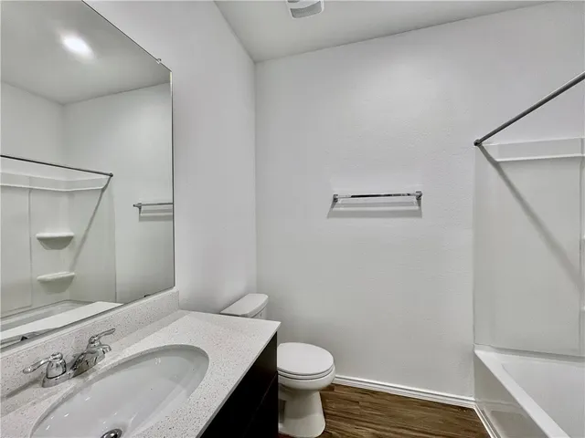 a bathroom with a sink and toilet