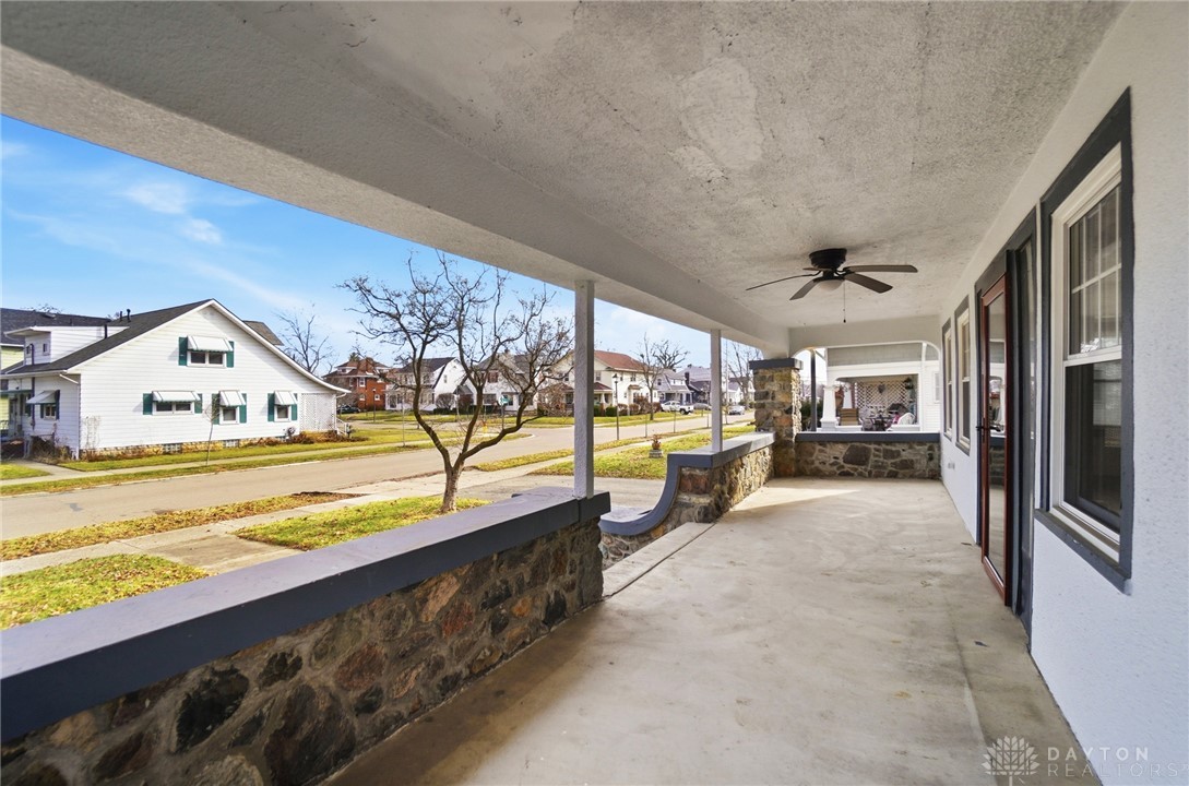 25 Englewood Road Springfield, OH 45504 - Photo 66 of 66 This inviting covered porch offers serene neighborhood views, perfect for outdoor relaxation.