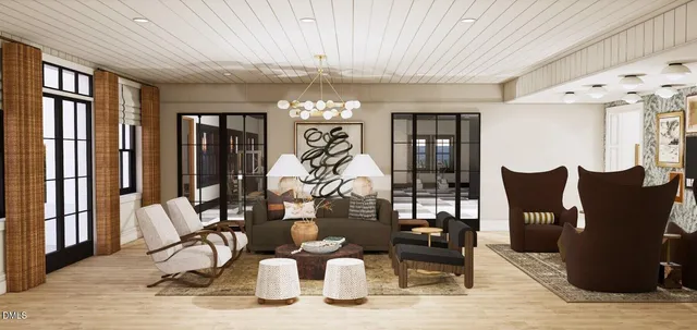 a living room with furniture and a chandelier