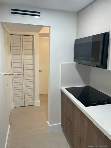 a view of kitchen and utility room