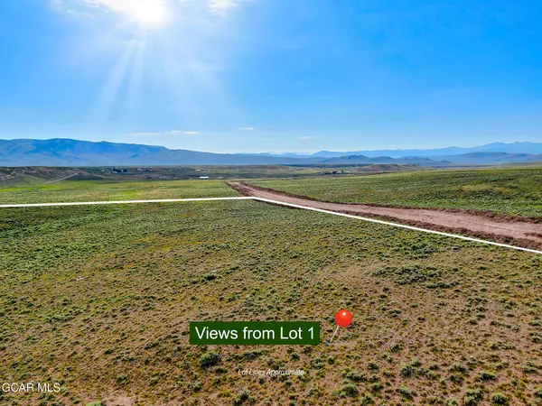 a view of an ocean and a mountain