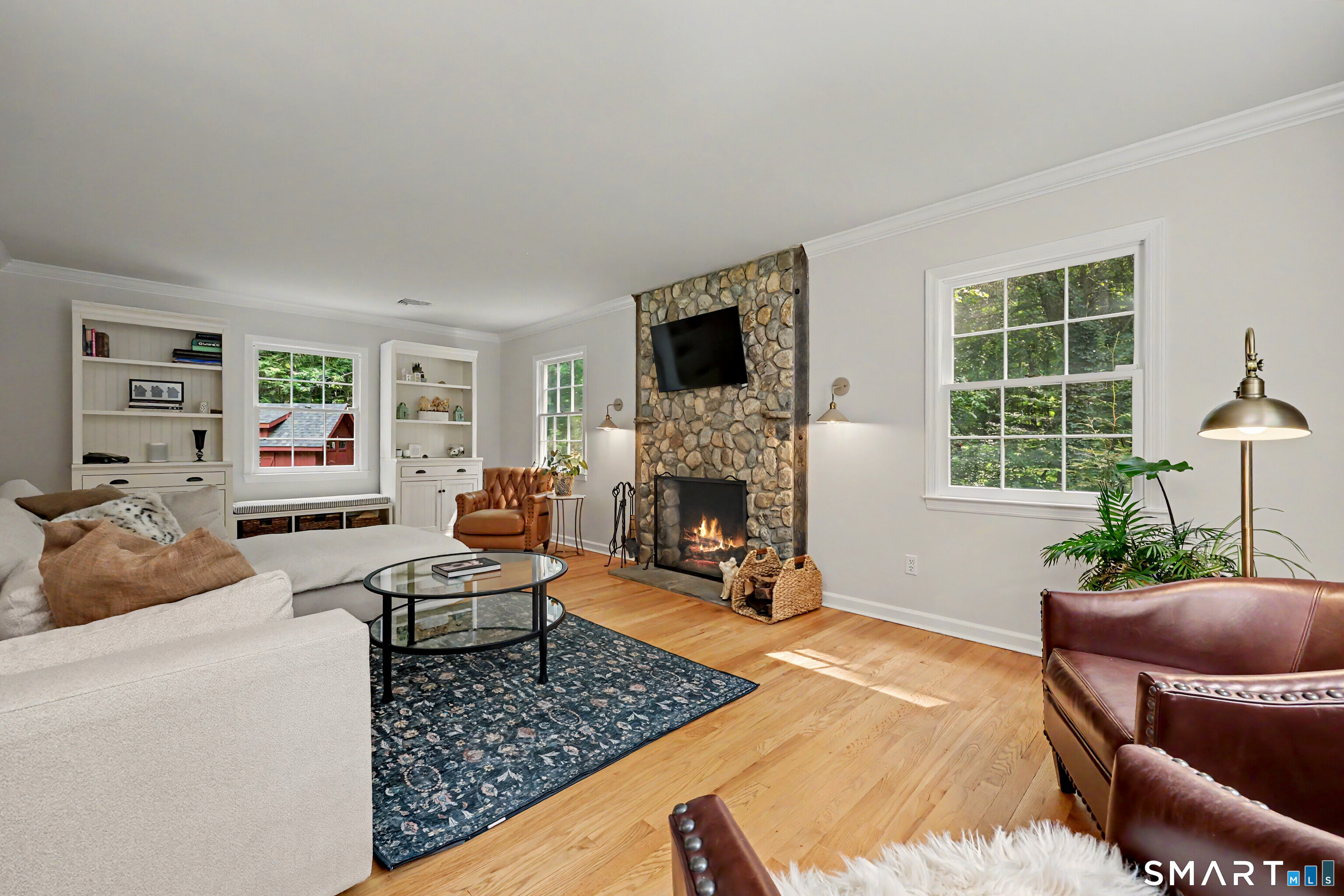 241 Mountain Road Wilton, CT 06897 - Photo 4 of 32 Inviting Family Room with Floor to Ceiling Stone Fireplace.