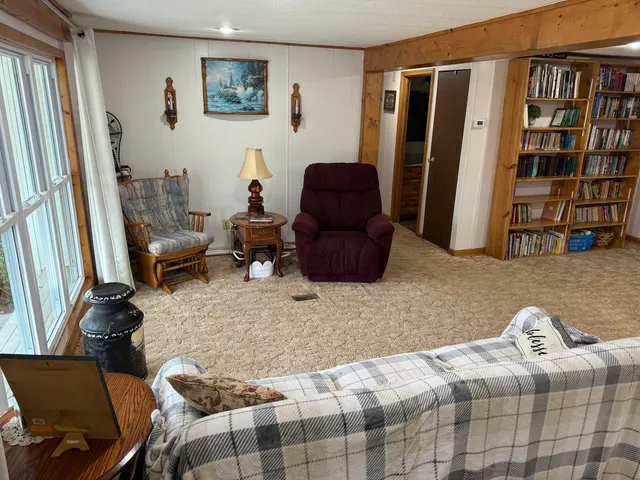 a kitchen with a table chairs sink and refrigerator