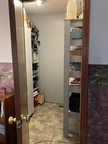 a bedroom with a bed and a mirror