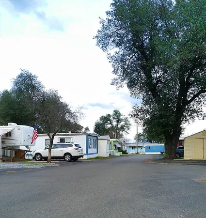 a view of street with parked cars