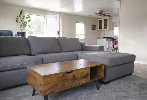 a living room with furniture and a window
