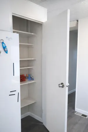 a view of an empty walk in closet