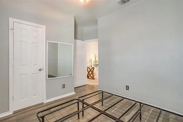a view of an entryway with wooden floor