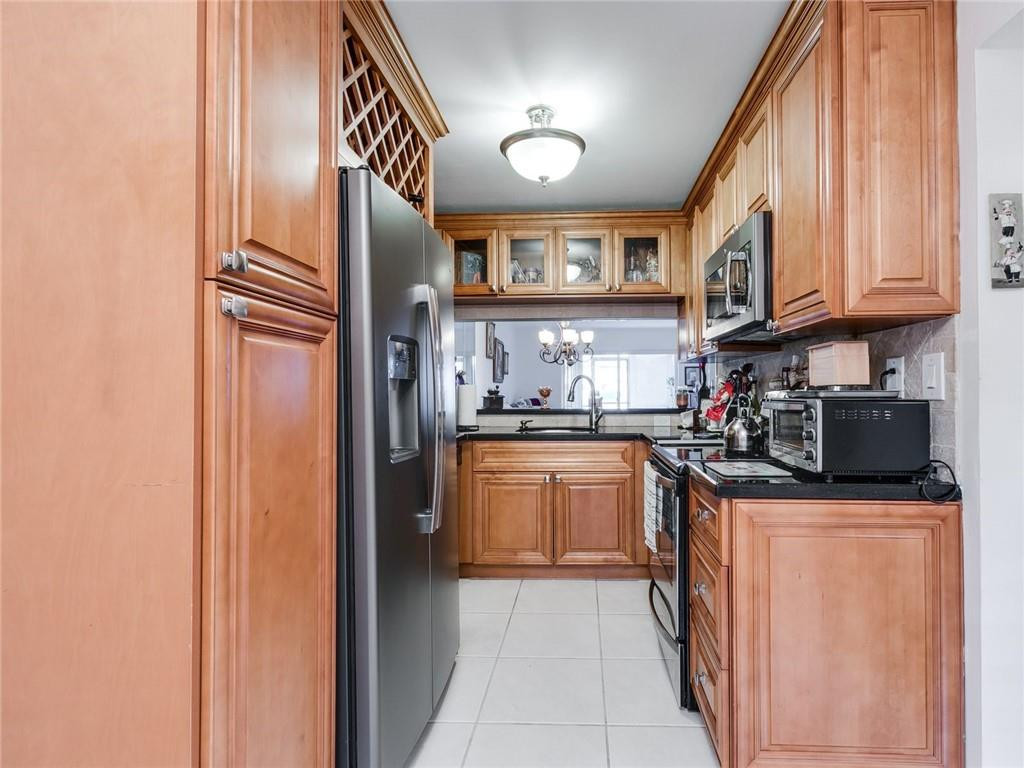 9569 West McNab Road, Unit 9569 Tamarac, FL 33321 - Photo 7 of 39 Kitchen