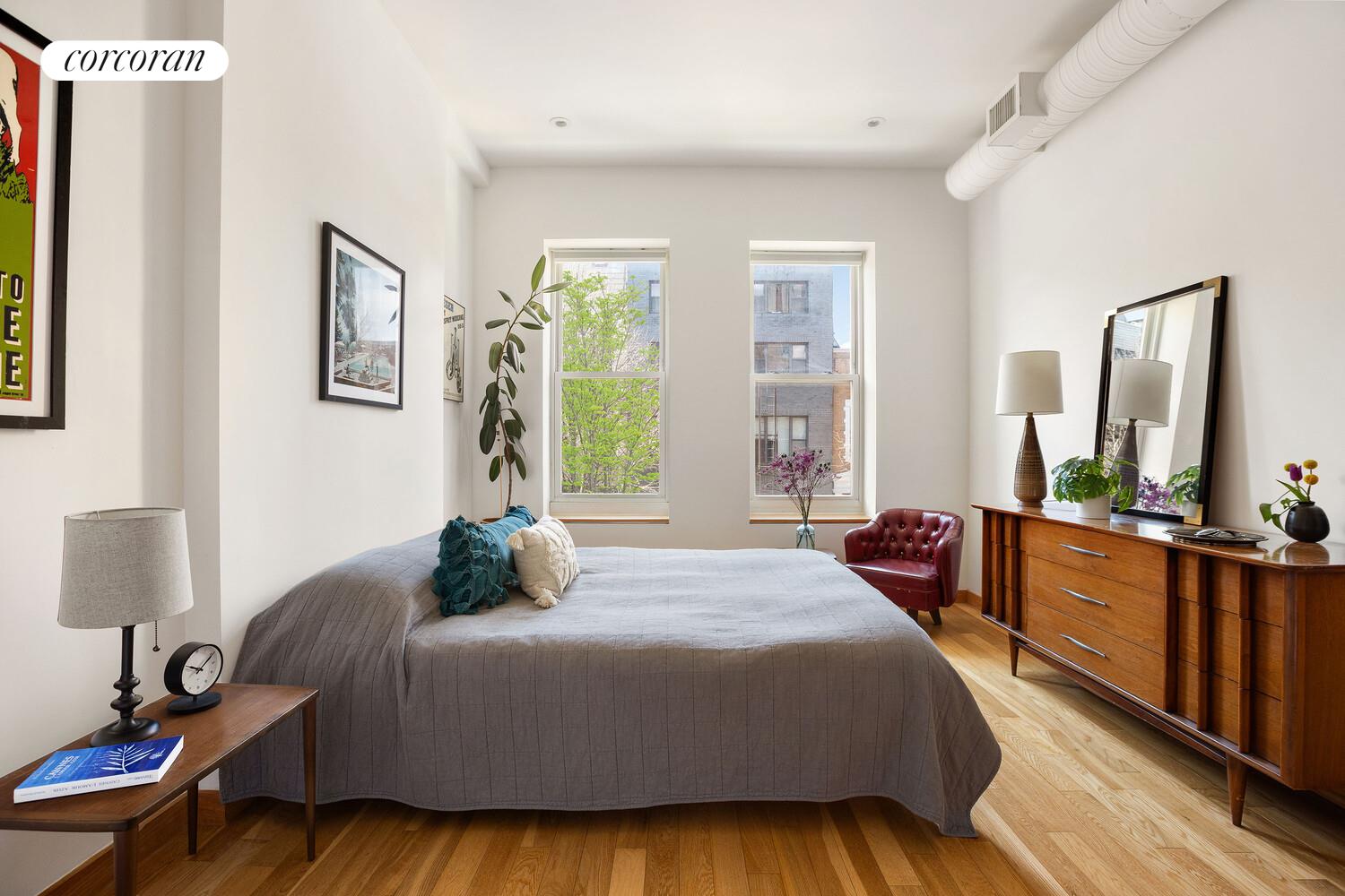 794 Hart Street, Unit 2B Brooklyn, NY 11237 - Photo 3 of 7 a bedroom with bed and wooden floor