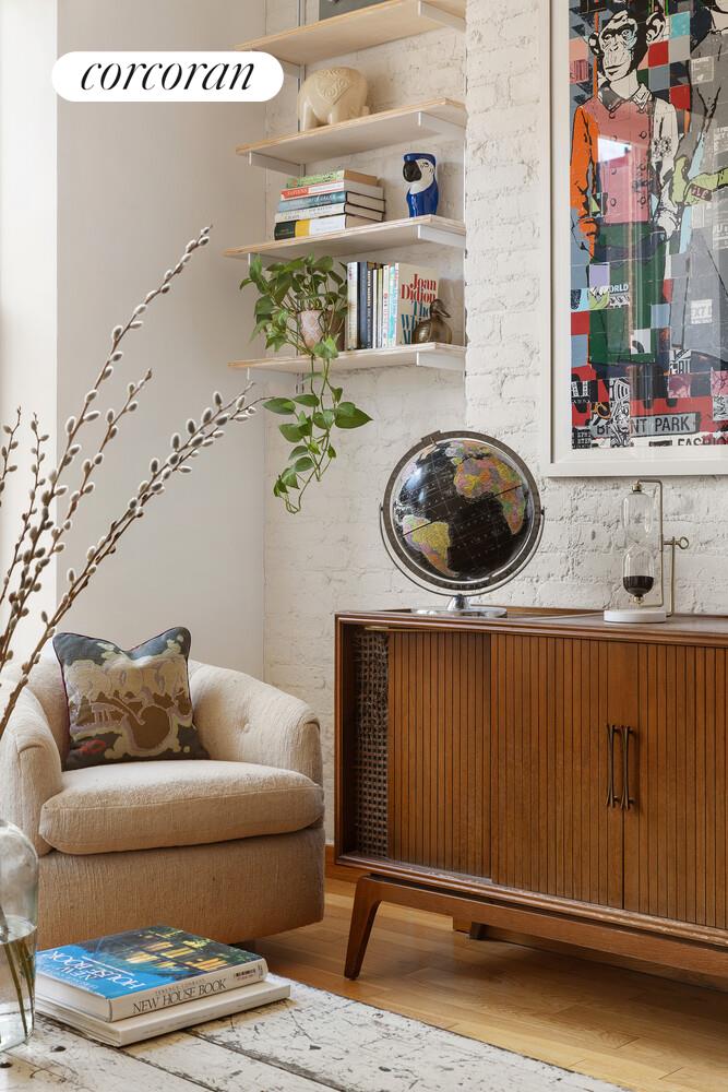 794 Hart Street, Unit 2B Brooklyn, NY 11237 - Photo 5 of 7 a living room with furniture and a mirror