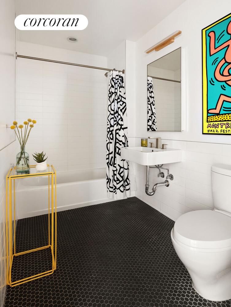 794 Hart Street, Unit 2B Brooklyn, NY 11237 - Photo 6 of 7 a bathroom with a sink toilet and shower