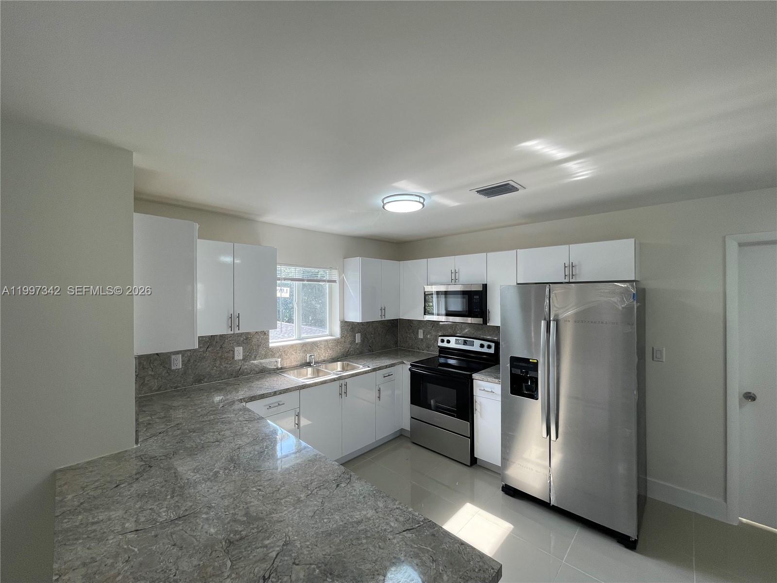 2268 Northwest 52nd Street, Unit TOP Miami, FL 33142 - Photo 3 of 10