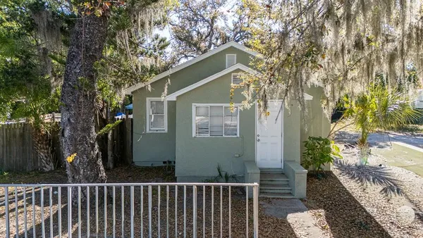 a view of a house with a small yard