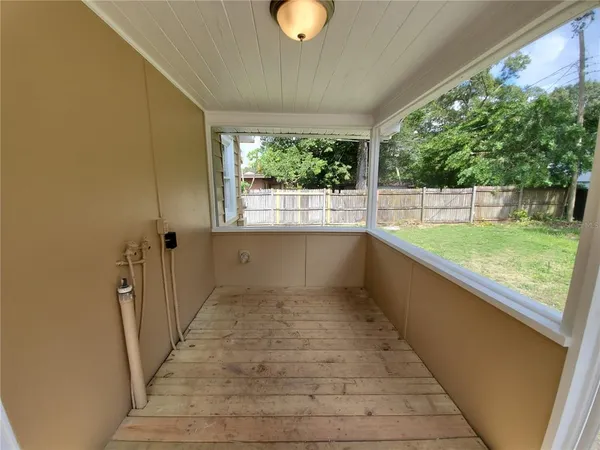 a view of a room with a large window