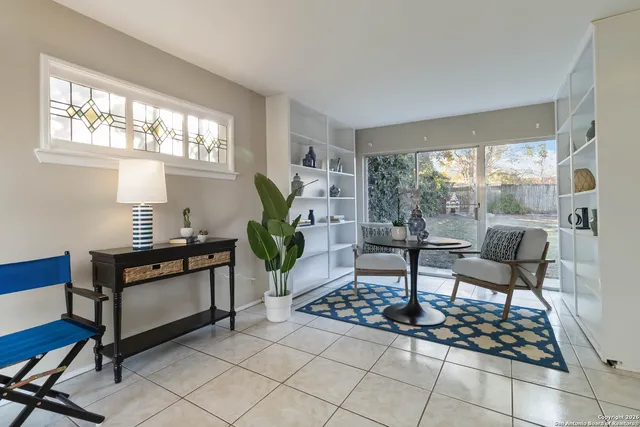 a living room with furniture and a table