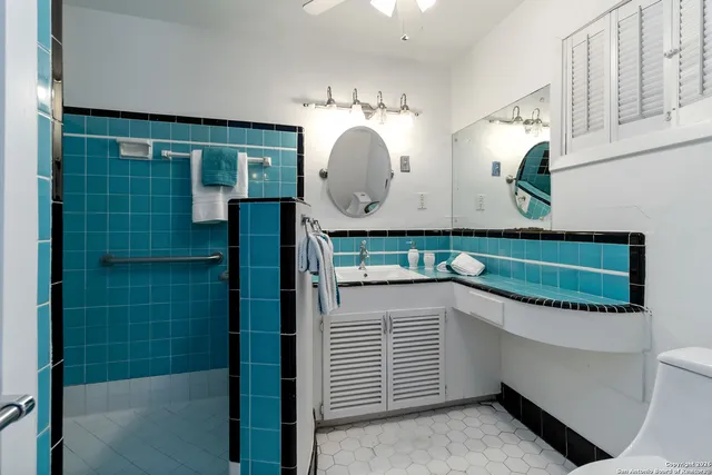 a view of a kitchen cabinets and a chandelier