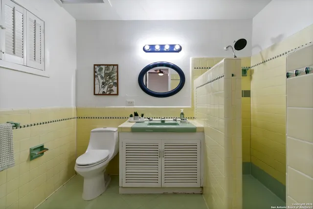 a bathroom with a toilet and a sink