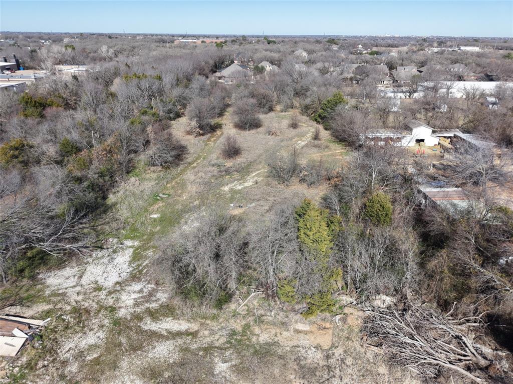 2809 Turner Warnell Road Arlington, TX 76001 - Photo 19 of 26 a view of a dry yard with trees