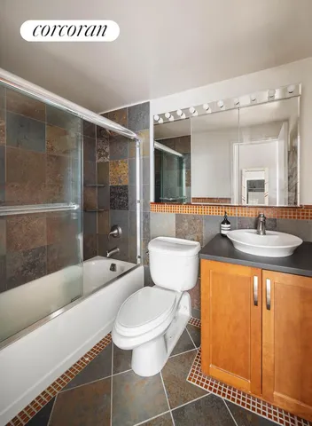 a kitchen with stainless steel appliances a stove a sink and a microwave