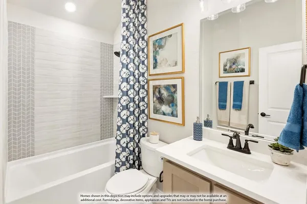 a bathroom with a sink a toilet a tub and shower