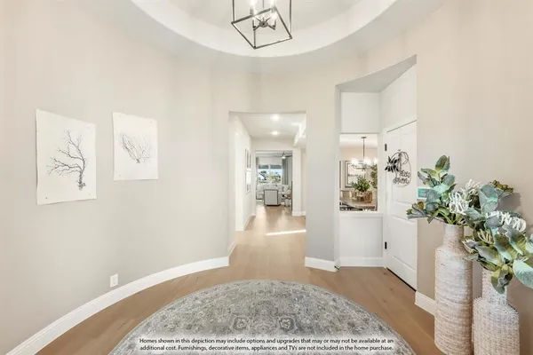 a view of a hallway with furniture and a rug
