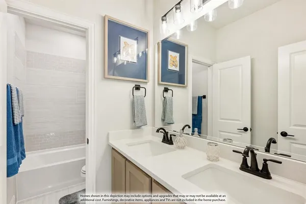 a bathroom with a tub sink and mirror