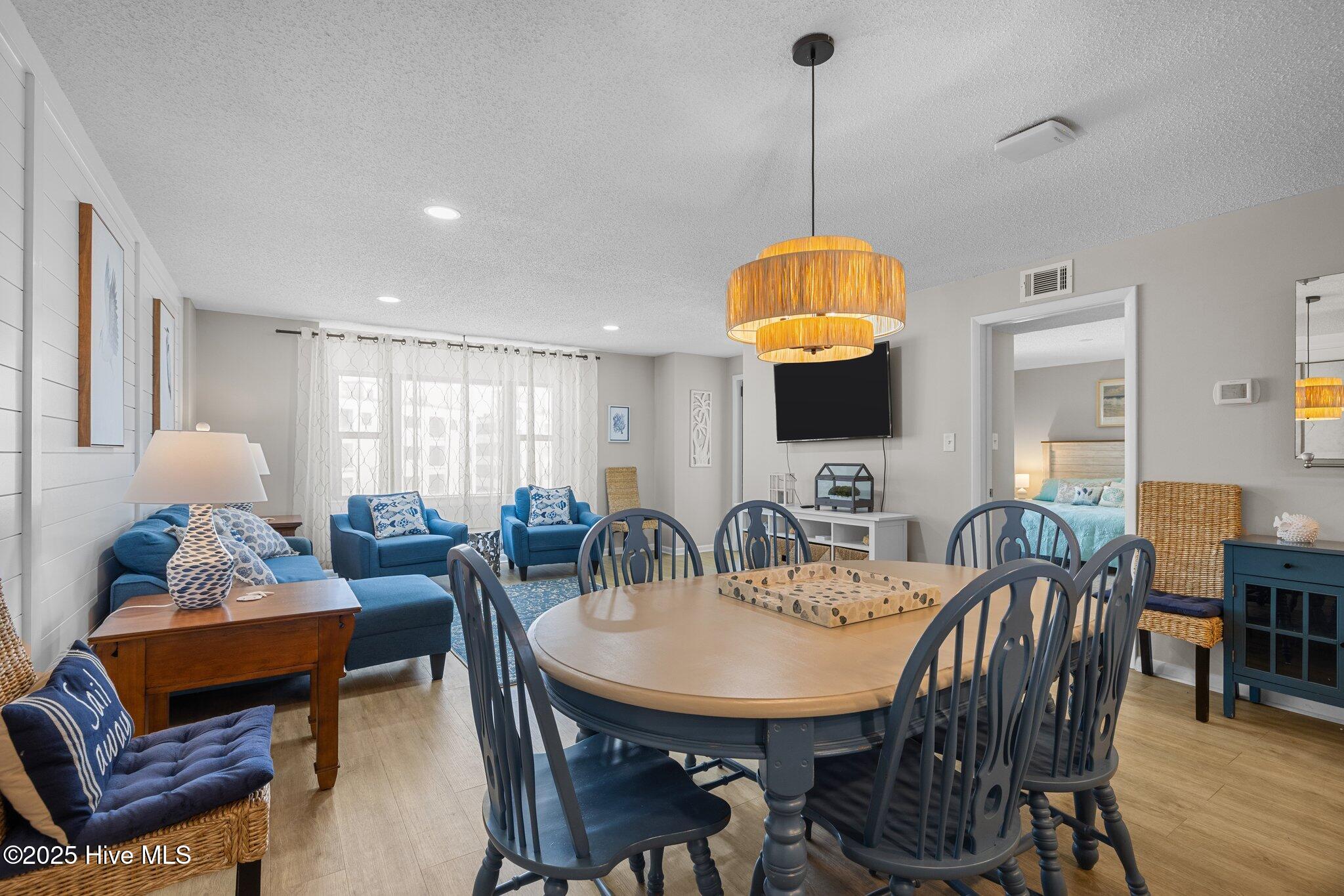 1505 Salter Path Road, Unit 409 Indian Beach, NC 28512 - Photo 16 of 35 Dining and Living Space