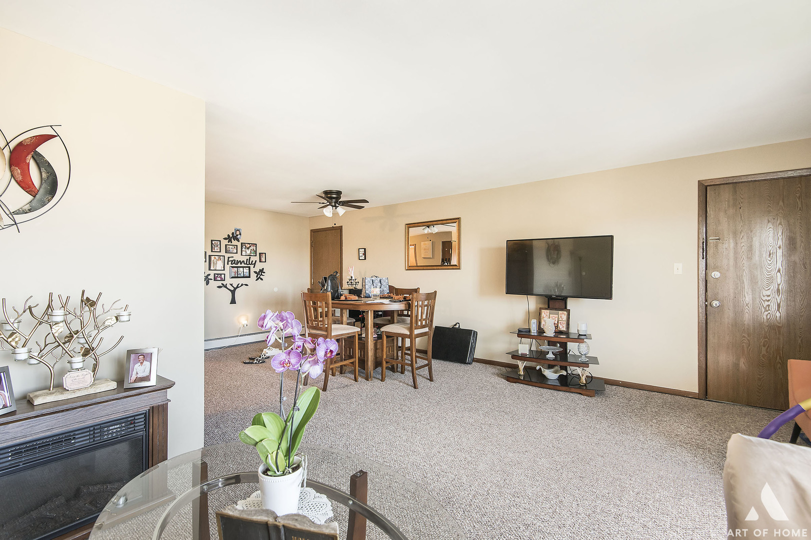 5731 106th Street Chicago Ridge, IL 60415 - Photo 11 of 25 a living room with furniture and a flat screen tv