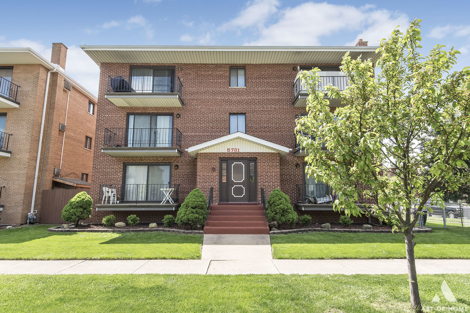 5731 106th Street Chicago Ridge, IL 60415 - Photo 23 of 25 a front view of a house with a yard and fountain