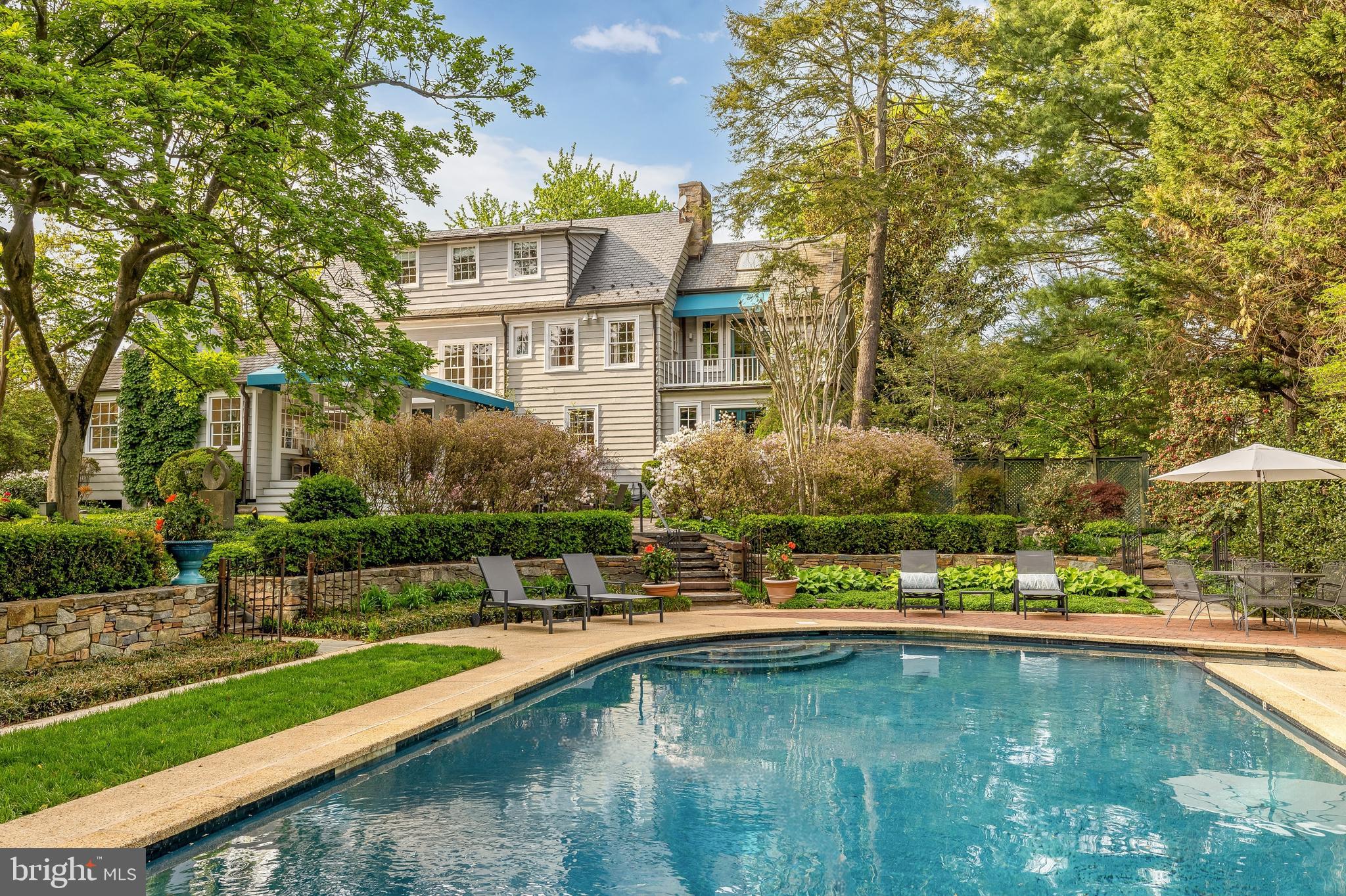 3306-3308 Rittenhouse Street Northwest Washington, DC 20015 - Photo 5 of 24 a view of a swimming pool with a garden