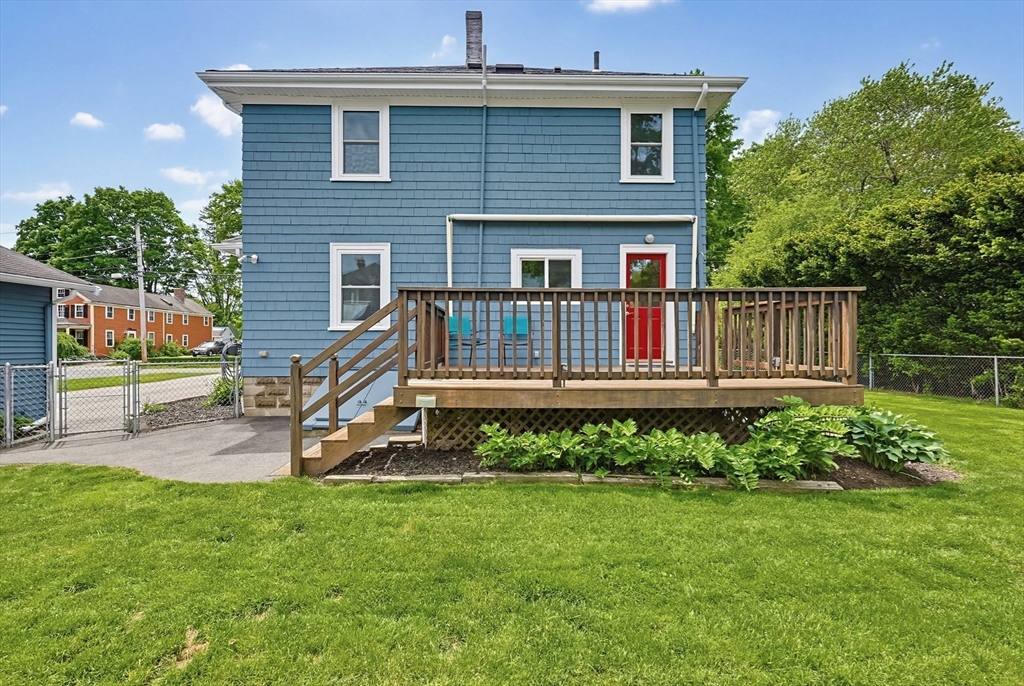 10 Water Street Natick, MA 01760 - Photo 32 of 35 a view of a house with a yard and deck
